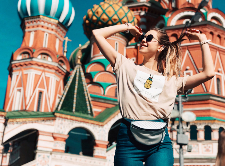 A candid shot of a woman in the facade of the St. Basil’s Cathedral, Moscow